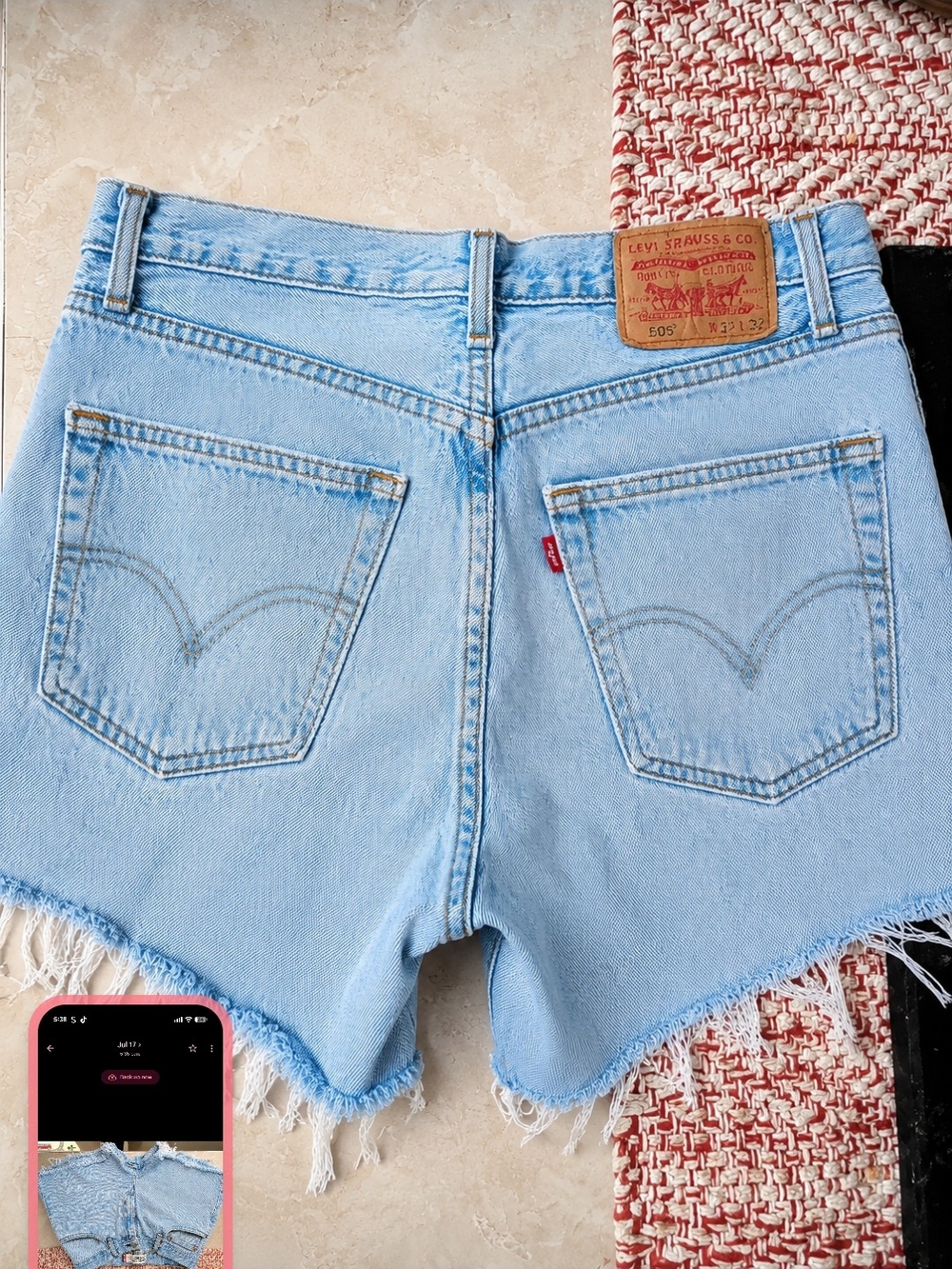 Levi's Light Wash Denim Frayed Hem Cutoff Shorts